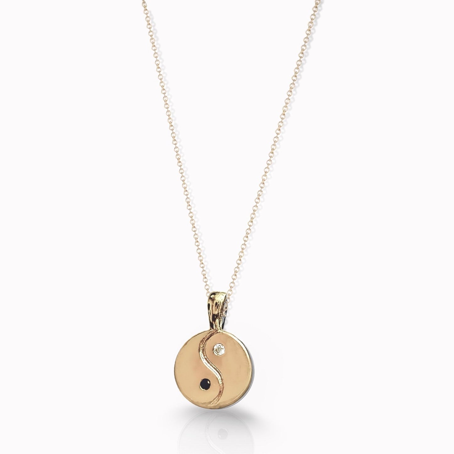 Makrub.wearitbecomeit Metalic gold coin necklace with a symbol of Yin Yang